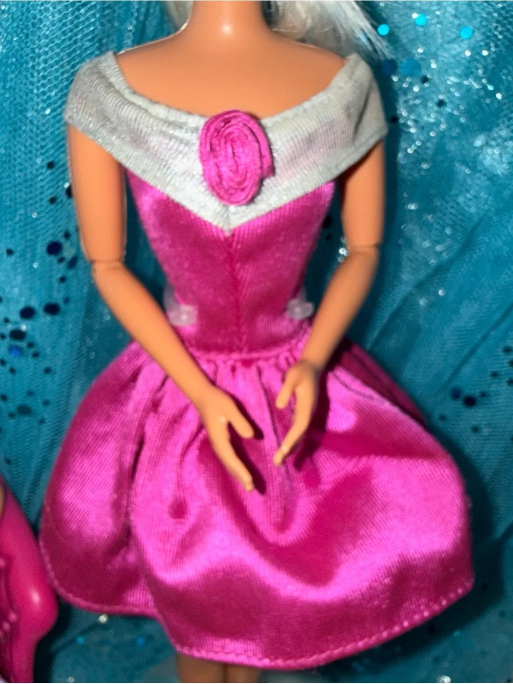 2 Barbie dolls in dresses 1 vintage 1 new chair not included